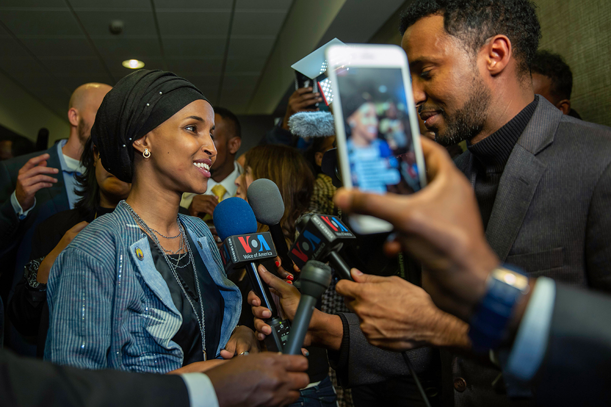 Ilhan Omar (L), newly elected to the U.S. House of Representatives on the Democratic ticket, speaks to the medias in Minneapolis, Minnesota on November 6, 2018. - US voters elected two Muslim women, both Democrats, to Congress on November 6, 2018, marking a historic first in a country where anti-Muslim rhetoric has been on the rise, American networks reported. Ilhan Omar, a Somali refugee, won a House seat in a heavily-Democratic district in the Midwestern state of Minnesota, where she will succeed Keith Ellison, himself the first Muslim elected to Congress. (Photo by Kerem Yucel / AFP)        (Photo credit should read KEREM YUCEL/AFP/Getty Images)