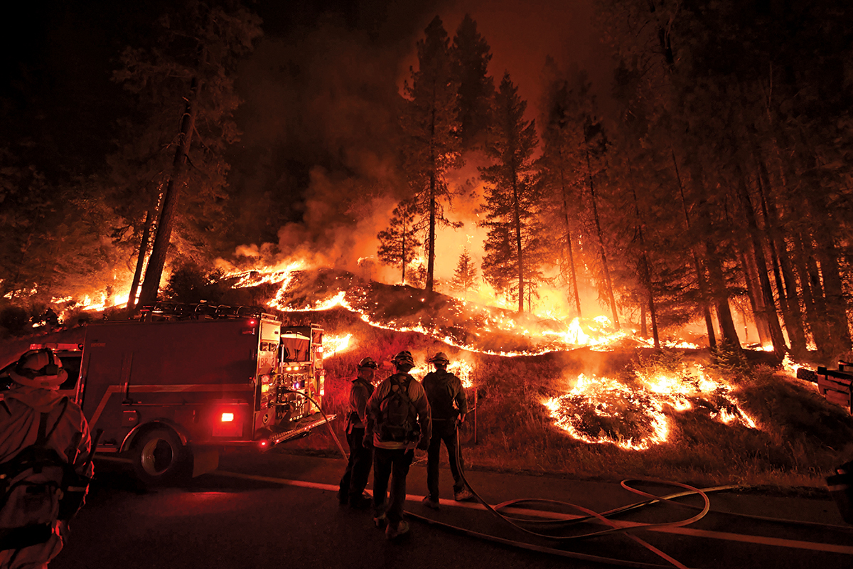 Firefighters try to control a blaze as it spreads toward the towns of Douglas City and Lewiston in California on July 31, 2018. (Mark Ralston/AFP/Getty Images)