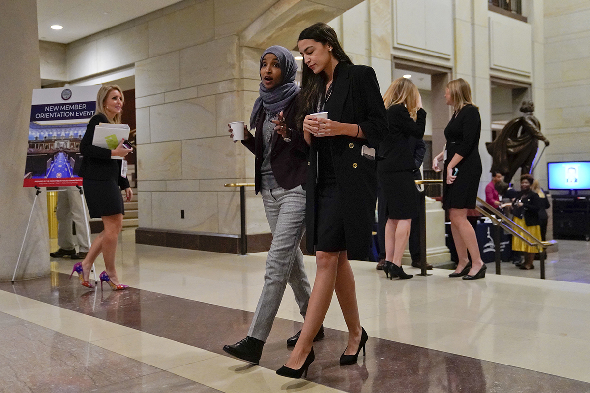 Alexandria Ocasio-Cortez (D-N.Y.) and IIhan Omar (D-Minn.) during member-elect briefings on Capitol Hill in Washington on Nov. 15, 2018. (Pablo Martinez Monsivais/AP)